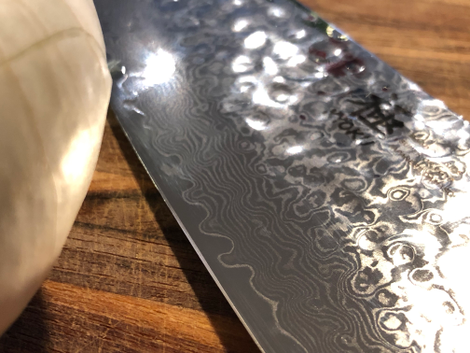 The rippled damascus steel is absolutely stunning.